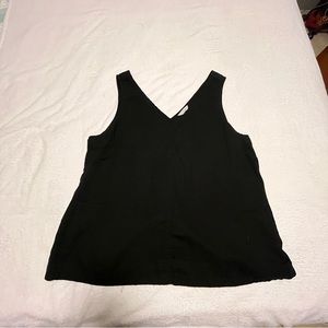 Black cotton tank. Heavier on the cotton side.